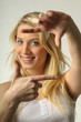 Young woman pretending picture frame with her fingers