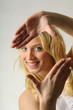 Young woman pretending picture frame with her fingers