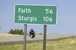 Photo: State Highway 34 with highway sign for Sturgis South Dakota and motorcycle driver heading for the 67th Annual Sturgis Motorcycle Rally, Sturgis, South Dakota, August 6-12, 2007 State Highway 34 with highway sign for Sturgis South Dakota and motorcycle driver heading for the 67th Annual Sturgis Motorcycle Rally, Sturgis, South Dakota, August 6-12, 2007