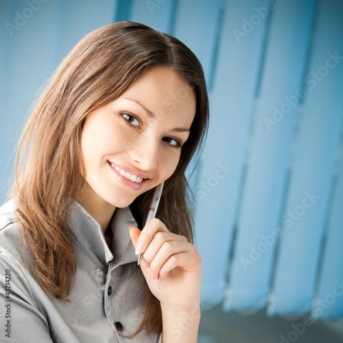 Photo: Young cheerful smiling businesswoman Young cheerful smiling businesswoman