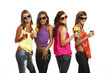 four girls have fun at the party, studio portrait