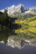 Photo: Autumn colors of Aspens reflecting in lake under Maroon Bells, Colorado, near Aspen Autumn colors of Aspens reflecting in lake under Maroon Bells, Colorado, near Aspen