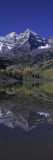 Photo: Panoramic view of autumn colors of Aspens reflecting in lake under Maroon Bells, Colorado, near Aspen Panoramic view of autumn colors of Aspens reflecting in lake under Maroon Bells, Colorado, near Aspen