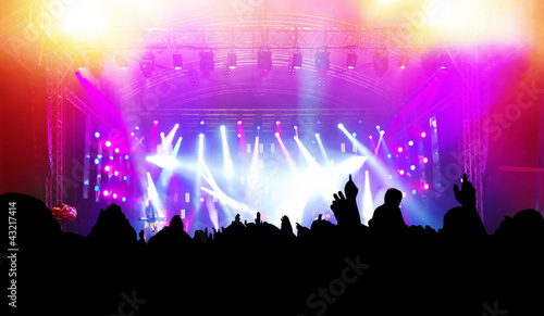 Photo: People having fun on music concert, disco party. People having fun on music concert, disco party.