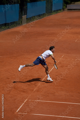 Photo: tennis player at the service tennis player at the service