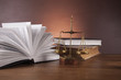 Law and justice stuff on wood table and dark background 