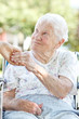 Foto: Senior Woman Holding Hands with Caretaker Senior Woman Holding Hands with Caretaker