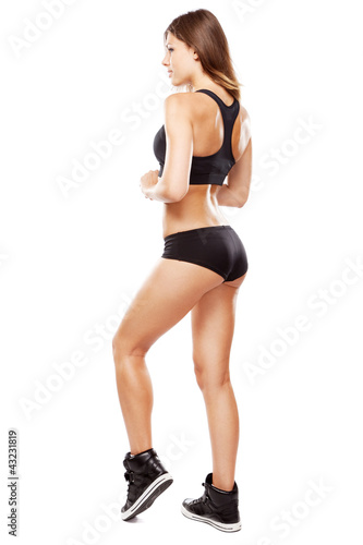 Photo: Young fit woman in sports outfit Young fit woman in sports outfit