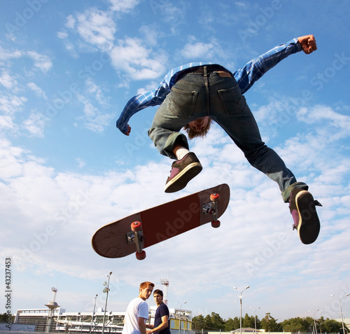 Photo: Skater jumps high in air Skater jumps high in air