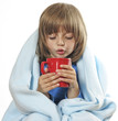 sick little girl with a cup of hot tea