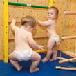 Two baby twins playing sports and climbing the stairs