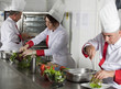 Foto: group of young beautiful professional chefs portrait in industri group of young beautiful professional chefs portrait in industri