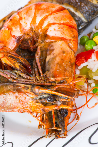 Photo: Giant prawns with sea bass fish. Giant prawns with sea bass fish.