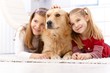 Cute little girls with pet dog smiling