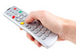 A hand holding a remote control, isolated on white background