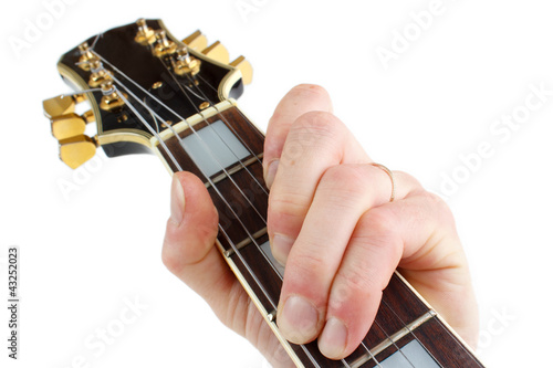 Photo: Playing electric guitar closeup, isolated on white Playing electric guitar closeup, isolated on white