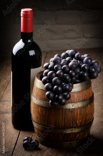Photo: Bottle of red wine, barrel and grape Bottle of red wine, barrel and grape