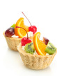 sweet cakes with fruits isolated on white