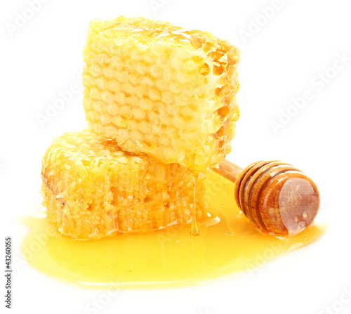 Photo: golden honeycombs with honey isolated on white. golden honeycombs with honey isolated on white.