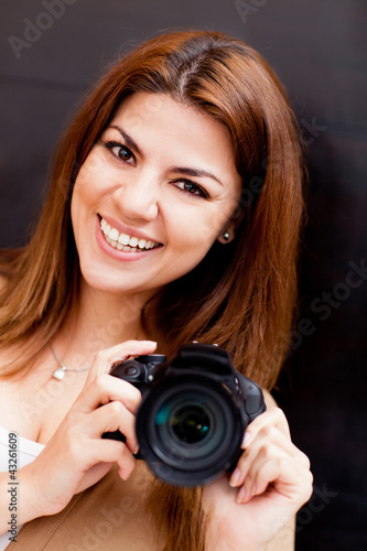 Photo: Woman with a digital camera Woman with a digital camera