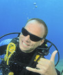Scuba Diver makes call me signal