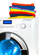 Pile of colorful clothes on the washing machine