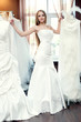 the bride trying on dresses in the bridal salon