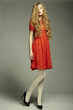 Fashion photo of young magnificent woman in red dress