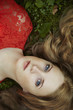 Fashion portrait of young sensual woman in garden