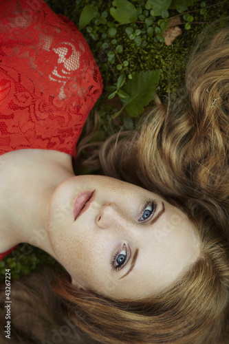 Photo: Fashion portrait of young sensual woman in garden Fashion portrait of young sensual woman in garden