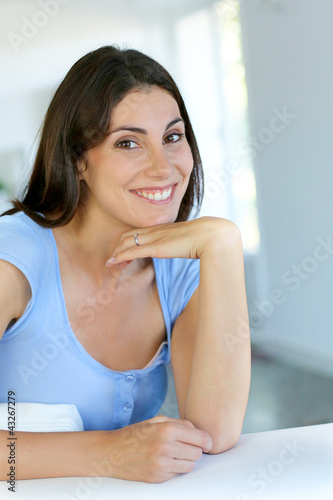 Photo: Closeup of smiling girl with satisfied look on her face Closeup of smiling girl with satisfied look on her face
