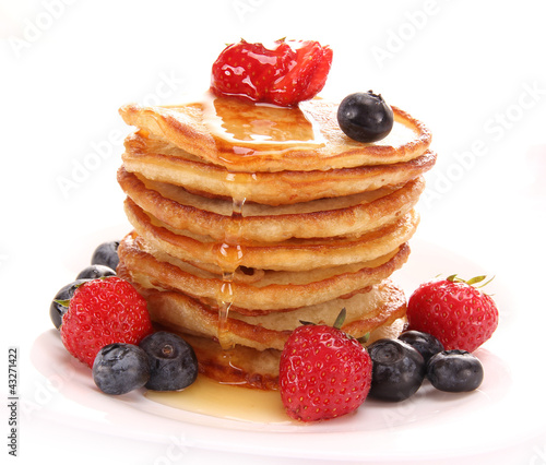 Photo: Small pancakes topped with honey Small pancakes topped with honey