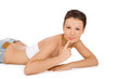 Cute woman lying on the floor isolated over a white
