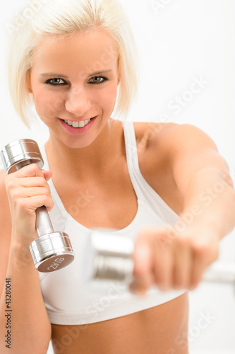 Photo: Excited fitness woman workout with weights Excited fitness woman workout with weights