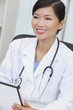 Chinese Female Woman Hospital Doctor Using Tablet Computer