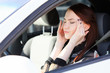 Foto: Woman with headache in a car Woman with headache in a car