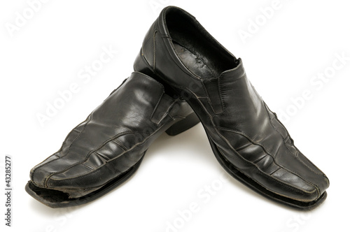 Photo: old shoe isolated on white background old shoe isolated on white background