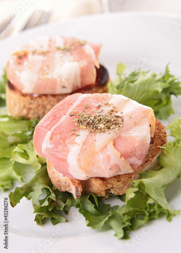 Photo: canape, bread with goat cheese rolled with bacon canape, bread with goat cheese rolled with bacon