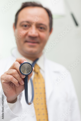 Foto: Doctor holding a stethoscope Doctor holding a stethoscope