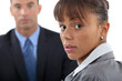 Concerned businesswoman and colleague