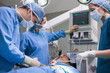 Photo: Doctors operating a patient Doctors operating a patient