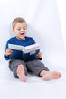 Photo: cute, little boy with book, on white cute, little boy with book, on white
