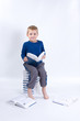 Photo: cute, little boy with books, on white cute, little boy with books, on white