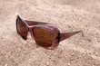 Foto: Sun glasses on a sand Sun glasses on a sand