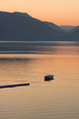 Photo: Lonely boat in the sea on sunrise Lonely boat in the sea on sunrise