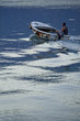 One man riding in the boat in bay