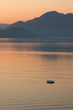 Photo: Lonely boat in the sea on sunrise Lonely boat in the sea on sunrise