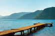 Photo: mountains and old wooden pier to the sea. mountains and old wooden pier to the sea.