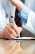 Closeup shot of a doctor writing a medical recipe