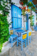 Photo: Greek traditional street taverna Greek traditional street taverna